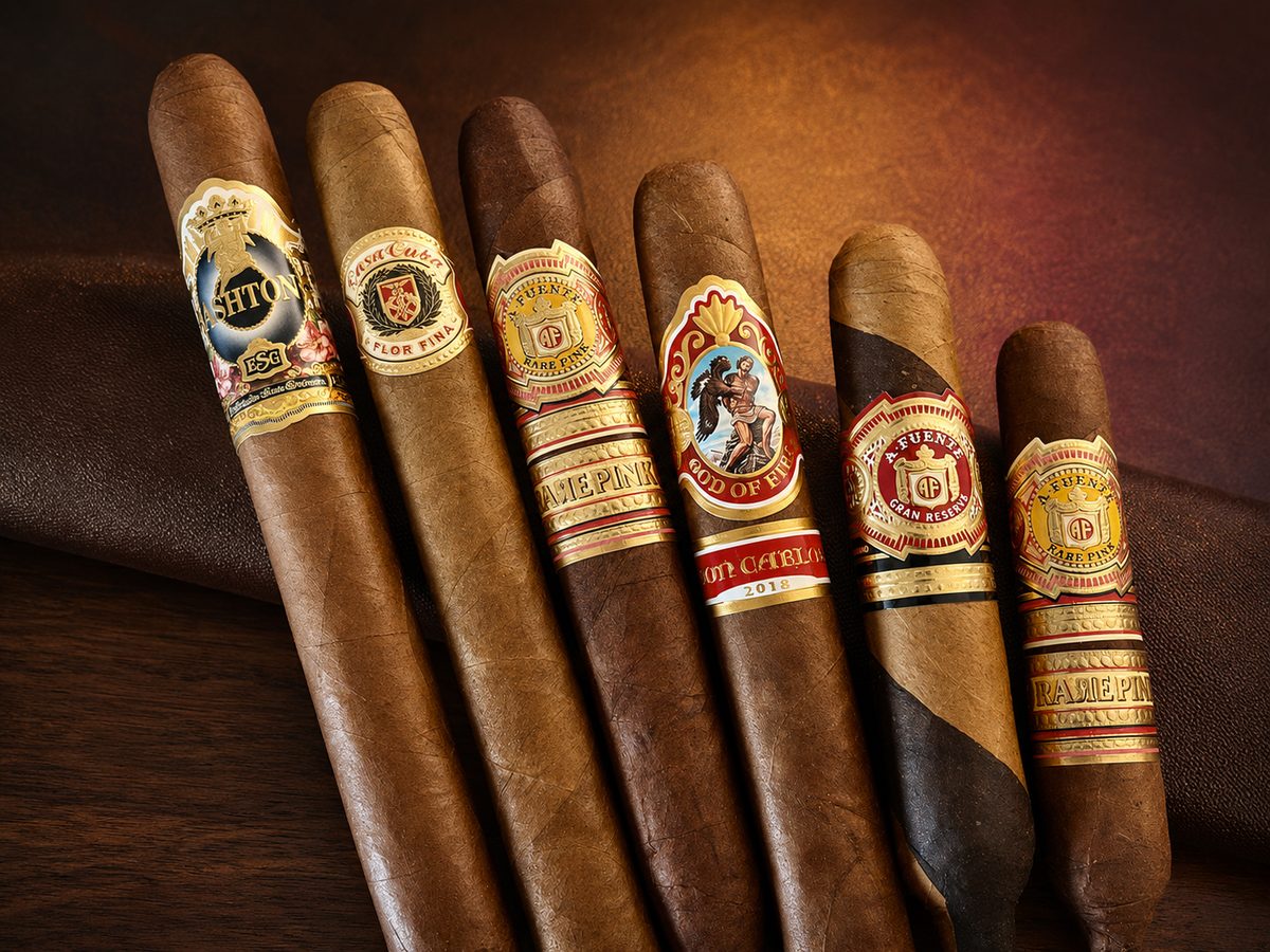 Arturo Fuente cigars — Rare Pink, Don Carlos God of Fire and Gran Reserva — on leather at iSmokee smoke shop near Disney in Orlando